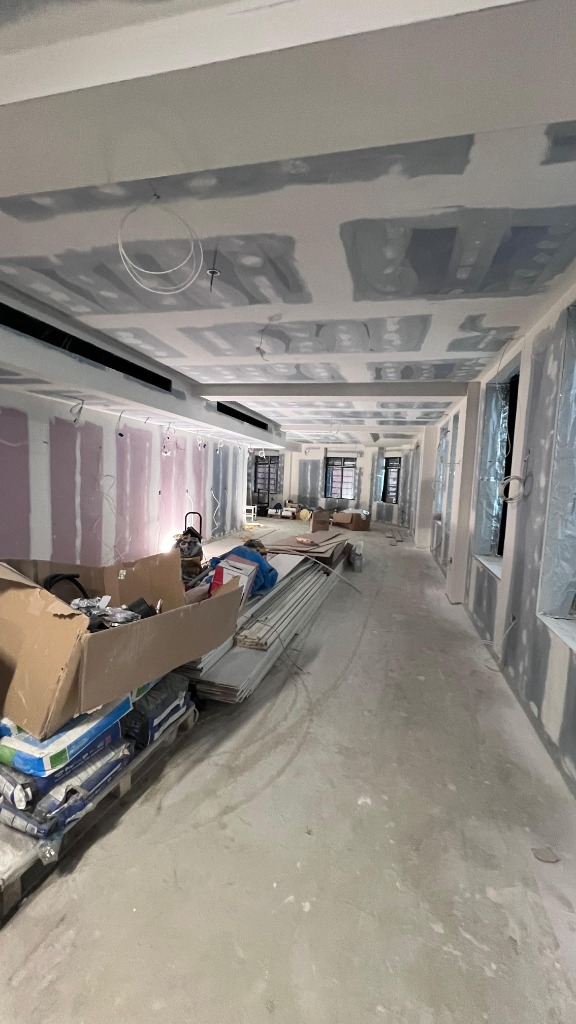 Drywall installation in commercial corridor