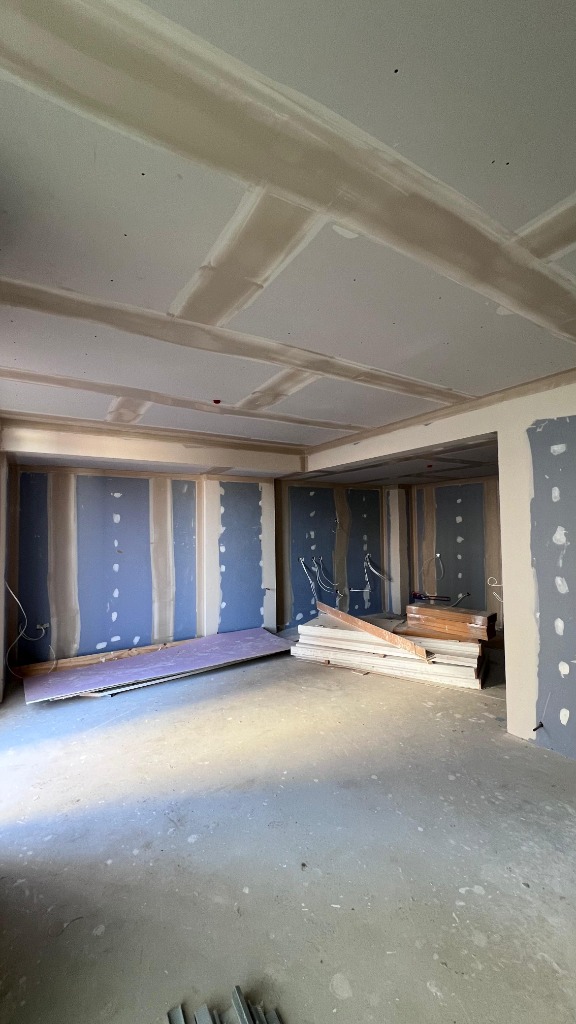 Room with blue drywall panels